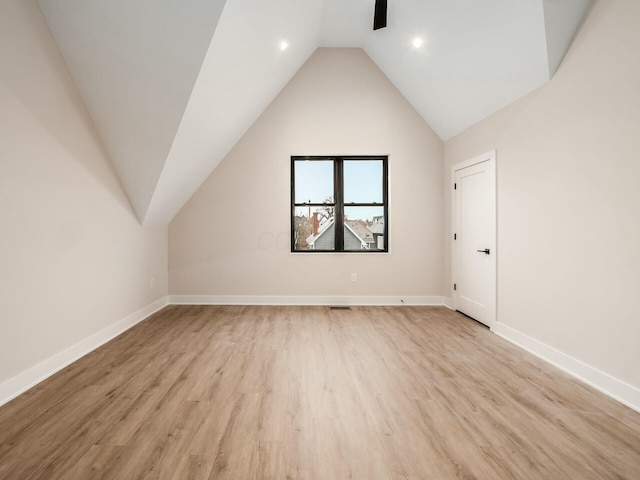 1093 Franklin Ave, Columbus, OH 43205 - additional living space featuring lofted ceiling, visible vents, ceiling fan, light wood-type flooring, and baseboards