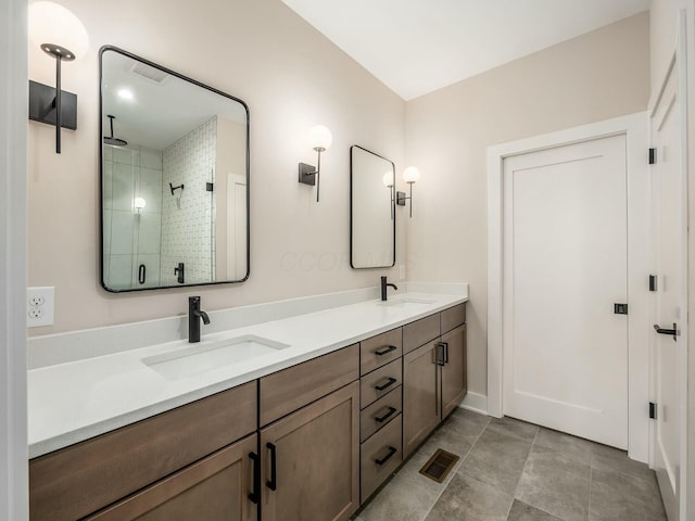 1093 Franklin Ave, Columbus, OH 43205 - full bathroom featuring visible vents, a sink, a shower stall, and double vanity