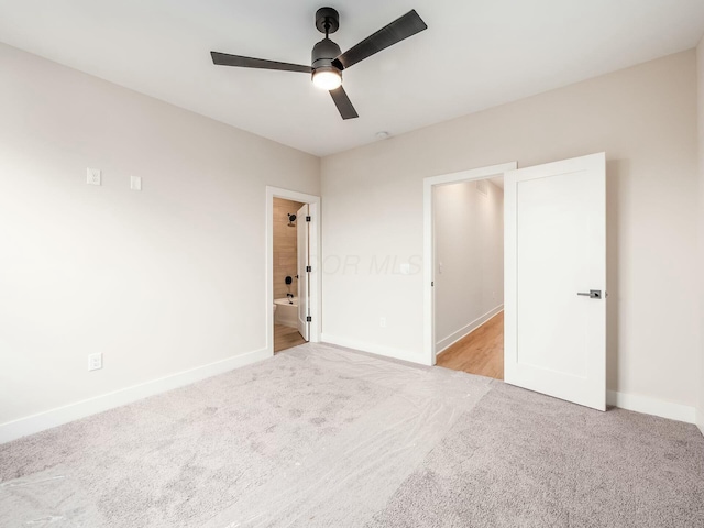 1093 Franklin Ave, Columbus, OH 43205 - unfurnished bedroom with carpet, ceiling fan, baseboards, and ensuite bathroom