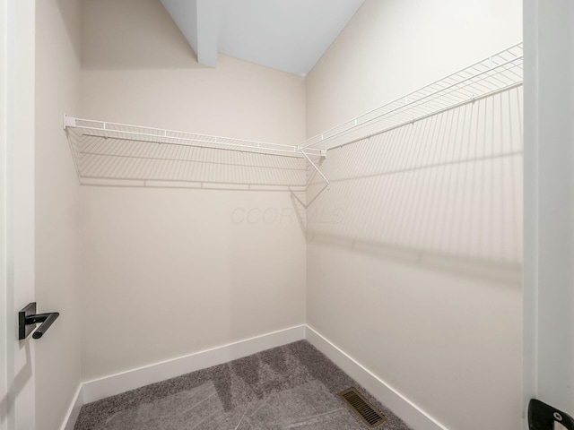 1093 Franklin Ave, Columbus, OH 43205 - walk in closet featuring visible vents and dark carpet