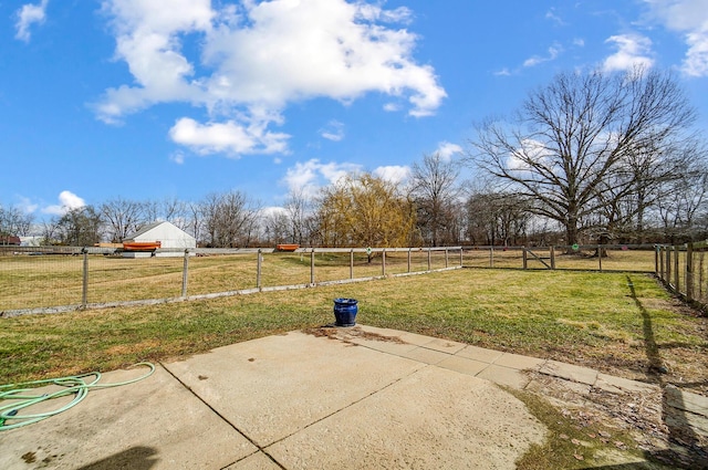 view of patio / terrace featuring a rural view and fence