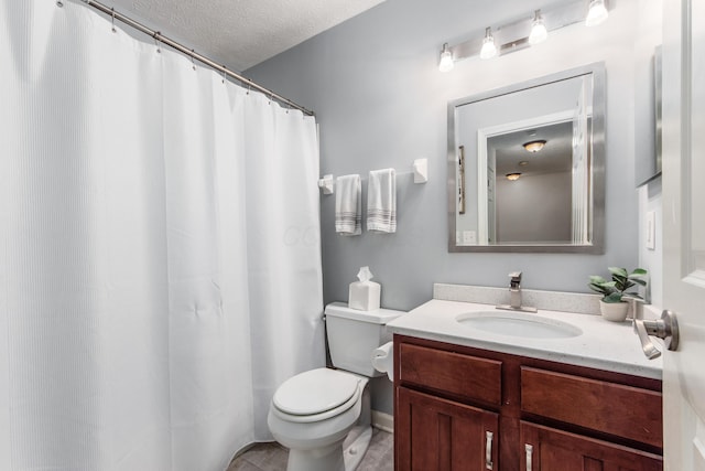 bathroom featuring a shower with shower curtain, toilet, a textured ceiling, vanity, and tile patterned flooring