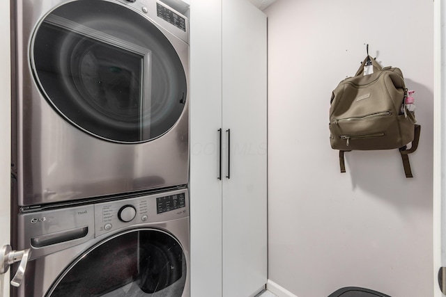 laundry room with laundry area and stacked washing maching and dryer