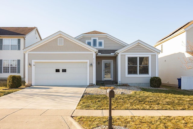 view of front of home featuring a garage and driveway