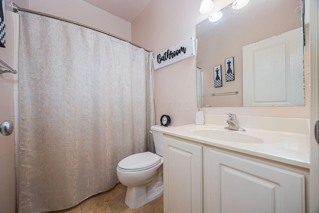 bathroom with a shower with curtain, toilet, vanity, and tile patterned flooring