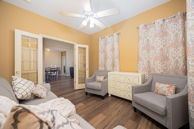 sitting room featuring a ceiling fan, wood finished floors, and french doors