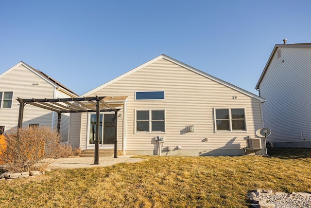 back of property featuring a lawn, a pergola, and a patio