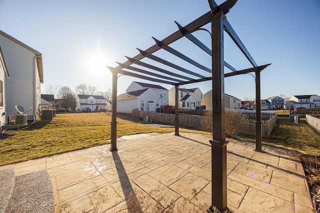 view of patio / terrace featuring a pergola, fence, a residential view, and central AC