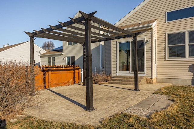 view of patio / terrace featuring fence, entry steps, and a pergola