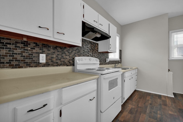 kitchen with light countertops, electric range, decorative backsplash, a sink, and under cabinet range hood