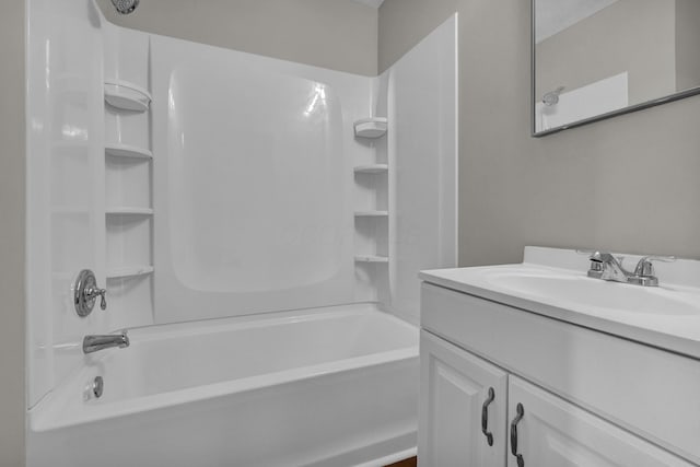 bathroom with washtub / shower combination and vanity