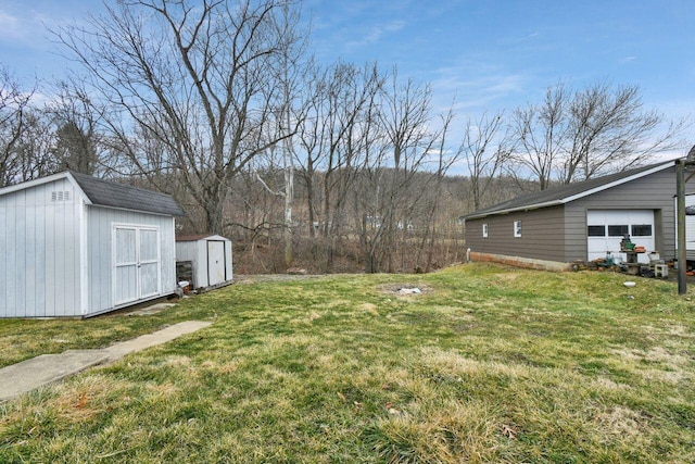 view of yard featuring an outbuilding and a shed