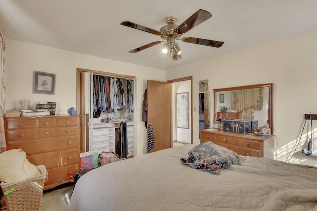 bedroom featuring ceiling fan and a closet