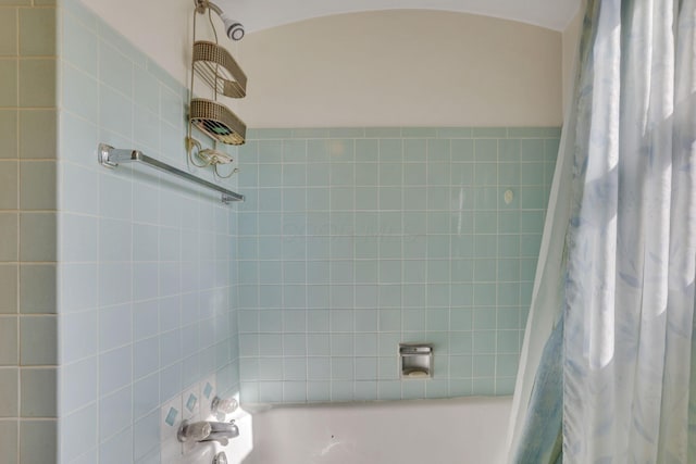 bathroom with shower / bath combination with curtain