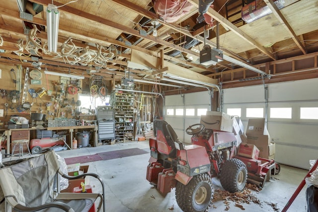 garage featuring a workshop area and a garage door opener