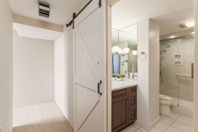 bathroom with visible vents, toilet, a shower stall, vanity, and tile patterned floors