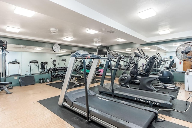 gym with wood finished floors