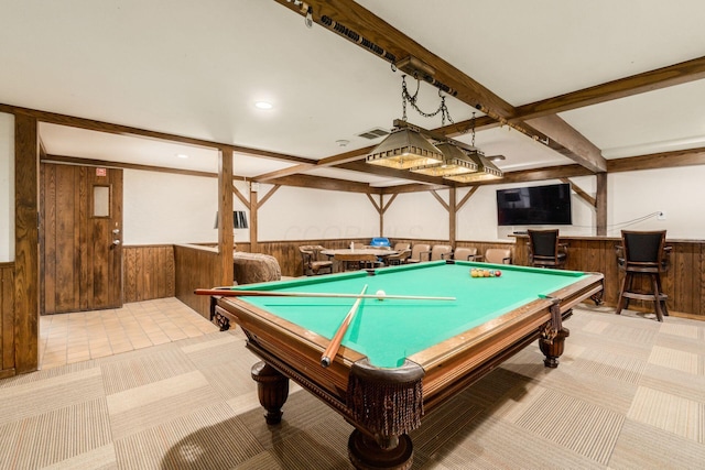 game room with a wainscoted wall, a dry bar, and wooden walls