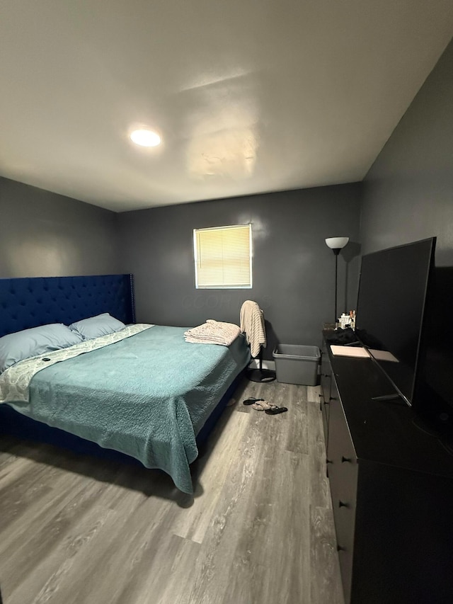 bedroom featuring wood finished floors