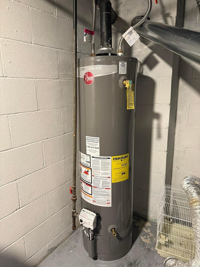 utility room featuring gas water heater