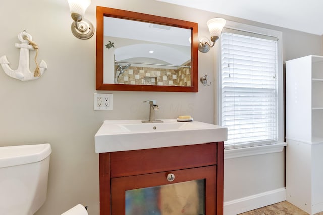 full bath featuring toilet, baseboards, and vanity