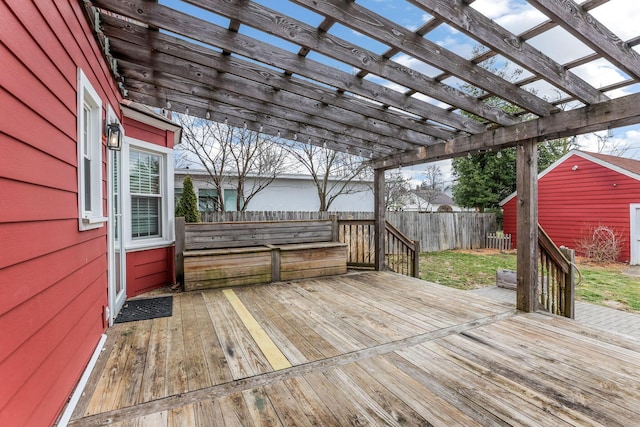 deck with a fenced backyard and a pergola