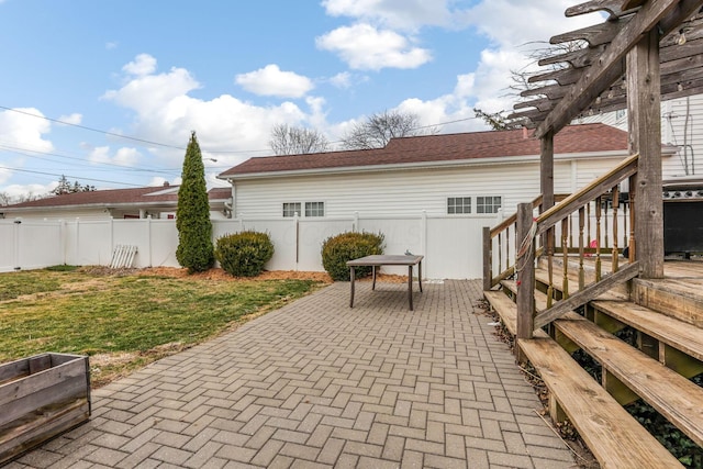 view of patio featuring fence