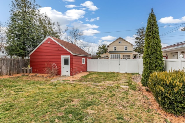 view of yard featuring an outbuilding and a fenced backyard