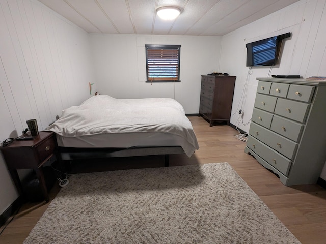 bedroom featuring light wood-style flooring