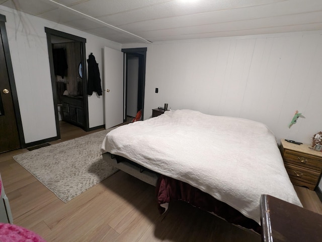 bedroom with light wood-type flooring