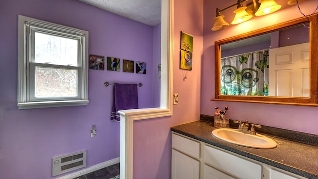 full bathroom featuring visible vents and vanity