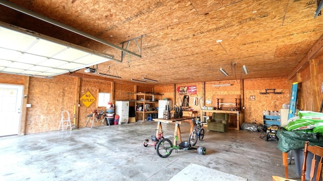 garage featuring a workshop area and a garage door opener