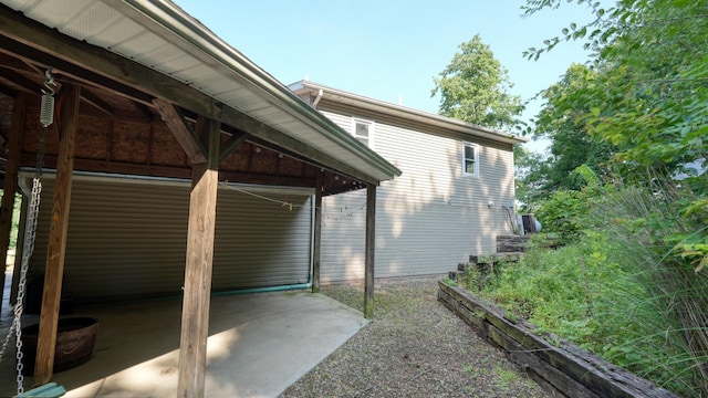 225 Homestead Dr, New Concord, OH 43762 - view of side of home with a patio