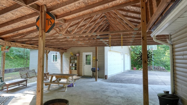 225 Homestead Dr, New Concord, OH 43762 - view of patio with a garage, an outdoor structure, and outdoor dining space