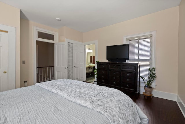 bedroom featuring dark wood-style floors and baseboards