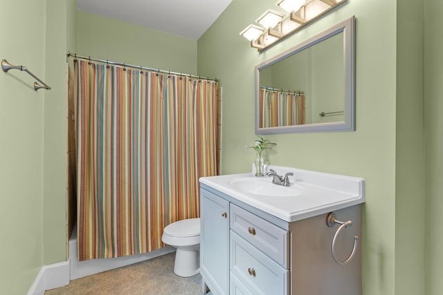 bathroom with toilet and vanity