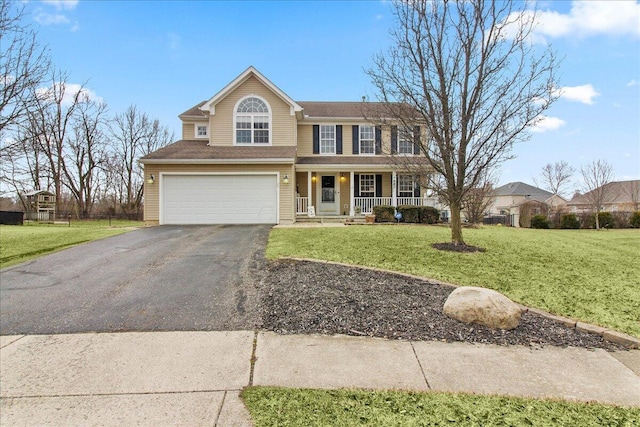 view of front facade featuring covered porch, driveway, a front lawn, and an attached garage