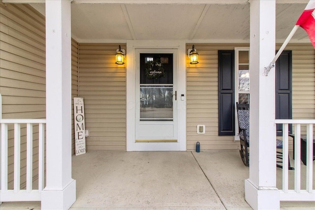 doorway to property featuring a porch