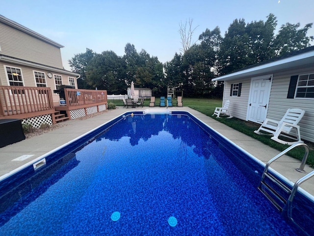 view of pool featuring a deck, a patio, and a fenced in pool