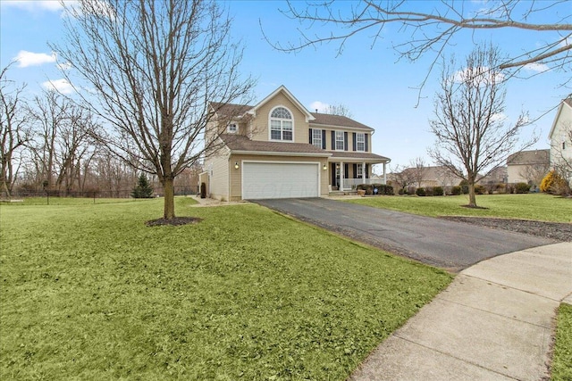 view of front of home with driveway, a front lawn, an attached garage, and fence