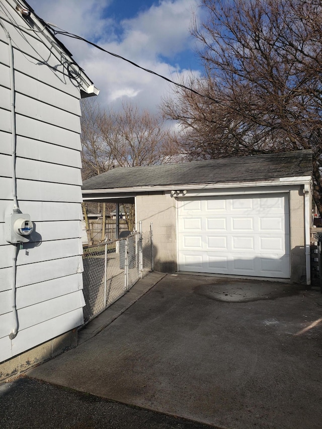 garage with fence