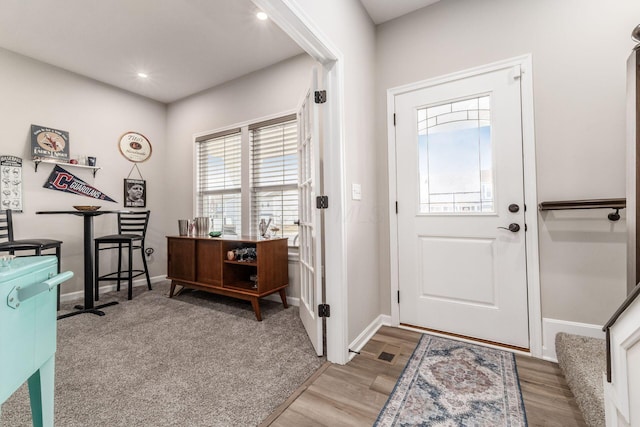 entryway featuring recessed lighting, baseboards, and wood finished floors