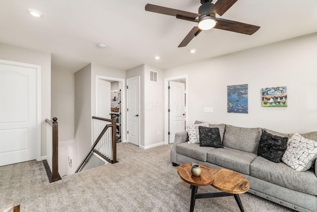 living room featuring carpet floors, recessed lighting, visible vents, and baseboards