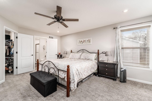 carpeted bedroom with a ceiling fan, recessed lighting, visible vents, and baseboards