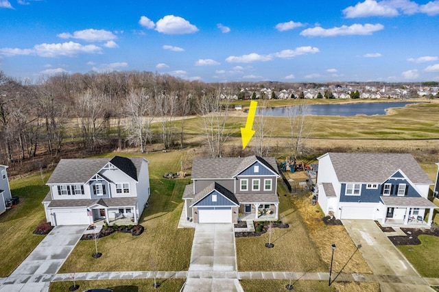 birds eye view of property with a residential view and a water view