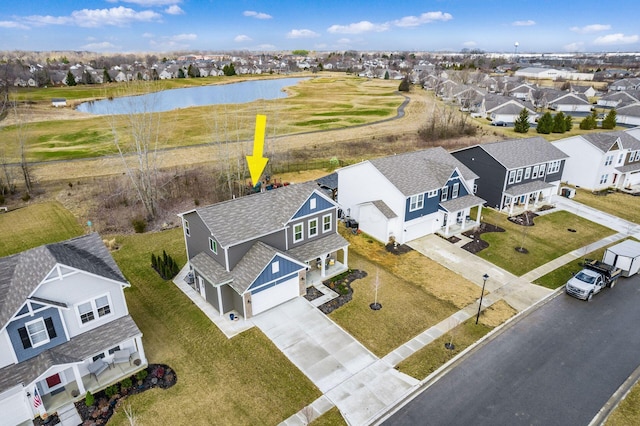 aerial view featuring a water view and a residential view