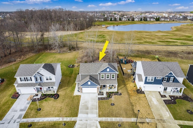 birds eye view of property featuring a water view