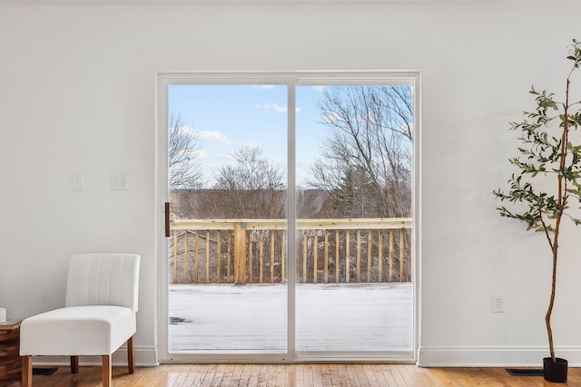 entryway featuring hardwood / wood-style flooring and baseboards