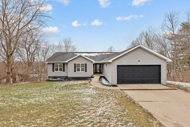 view of front of property with an attached garage, concrete driveway, and a front yard