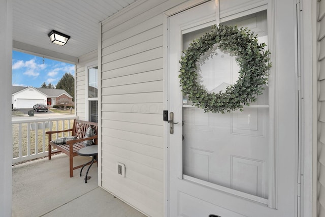 doorway to property with covered porch